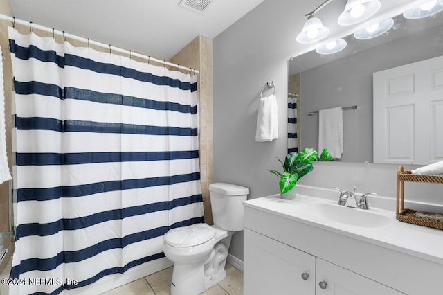 bathroom with tile patterned flooring, vanity, toilet, and a shower with shower curtain