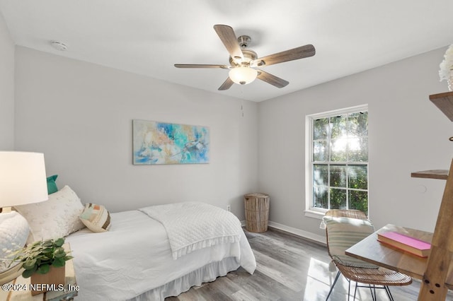 bedroom featuring ceiling fan and light hardwood / wood-style flooring