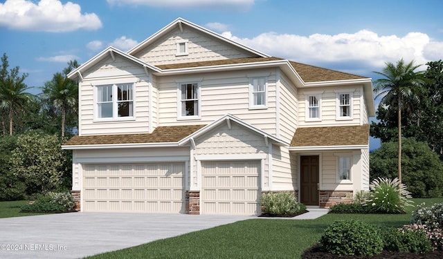 view of front of home featuring a front lawn and a garage