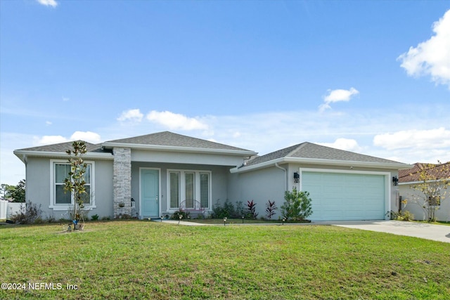 view of front of home with a front lawn and a garage