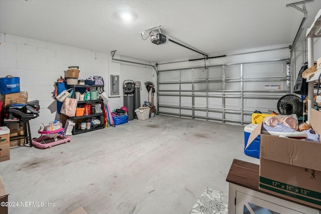 garage with electric panel and a garage door opener