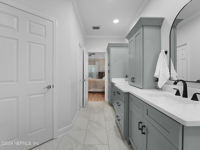 bathroom featuring vanity and ornamental molding