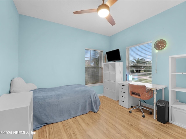 bedroom with ceiling fan and light hardwood / wood-style flooring