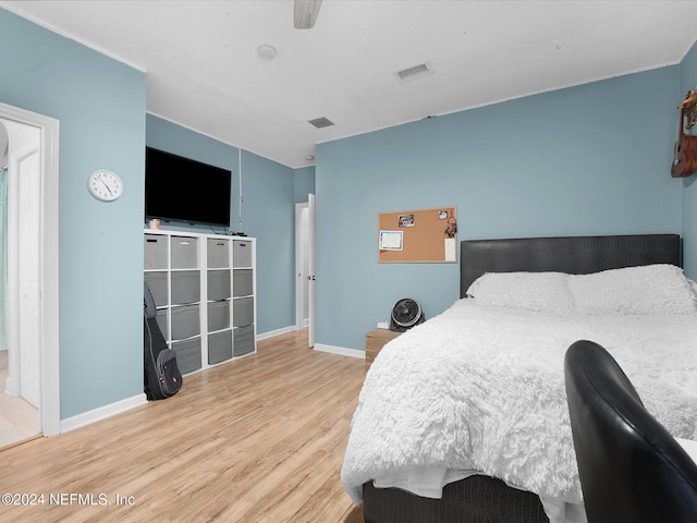 bedroom featuring hardwood / wood-style floors and ceiling fan