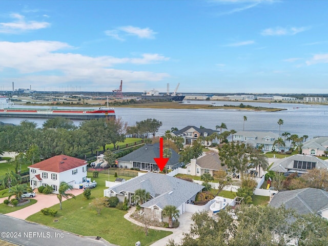 birds eye view of property with a water view