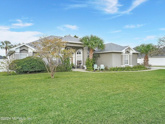 view of front of home with a front yard