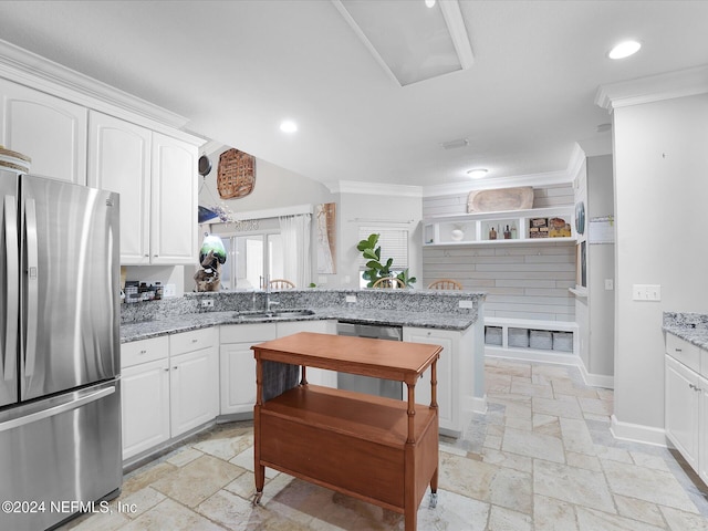 kitchen with white cabinetry, light stone countertops, and stainless steel appliances