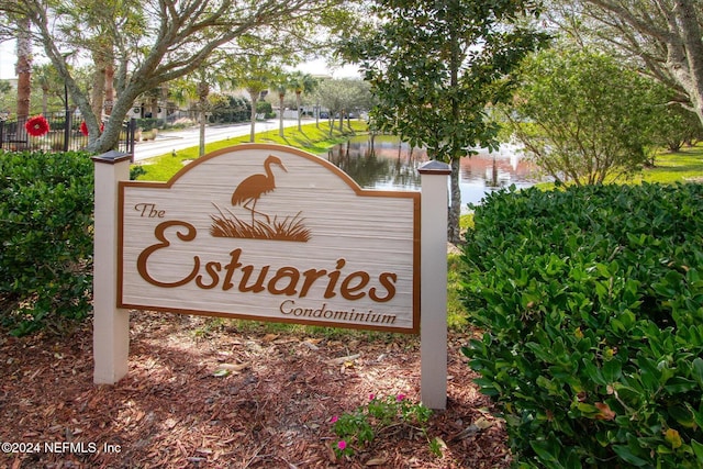 community sign with a water view