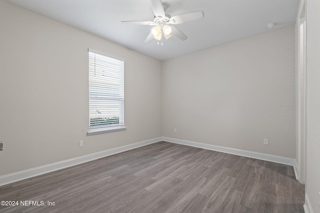 unfurnished room featuring hardwood / wood-style flooring and ceiling fan