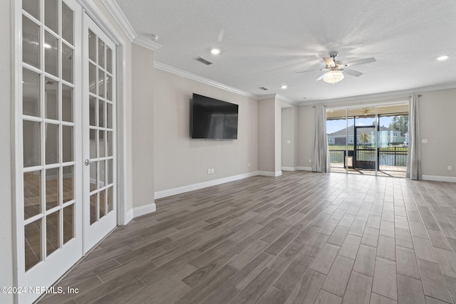 unfurnished living room featuring french doors, dark hardwood / wood-style flooring, a textured ceiling, ceiling fan, and crown molding