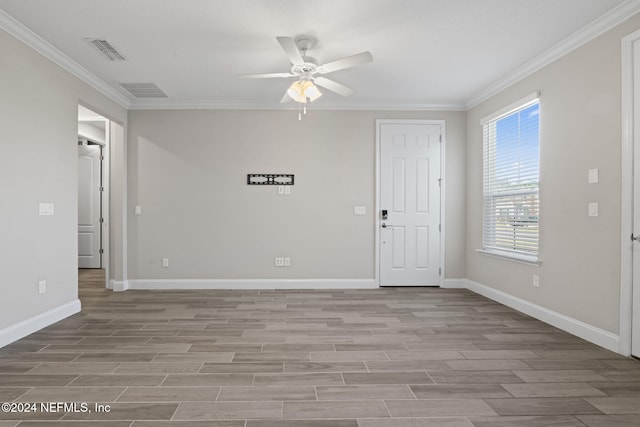 unfurnished room featuring ceiling fan, ornamental molding, and light hardwood / wood-style flooring