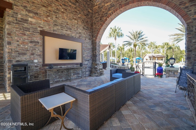 view of patio / terrace with an outdoor living space with a fireplace