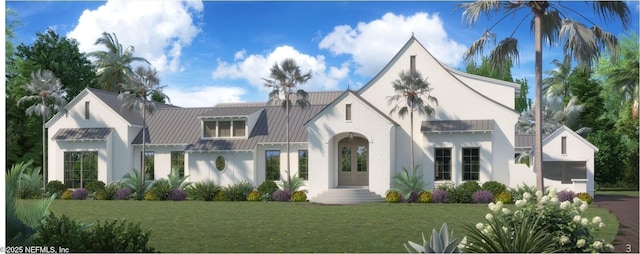 view of front of home with metal roof, an attached garage, brick siding, a standing seam roof, and a front yard