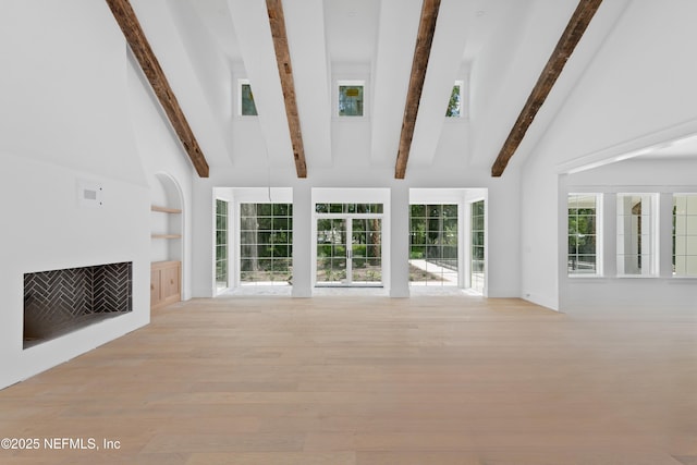 260 Autumn Tide Trl, Ponte Vedra, FL 32081 - unfurnished living room featuring high vaulted ceiling, wood finished floors, beamed ceiling, and built in shelves