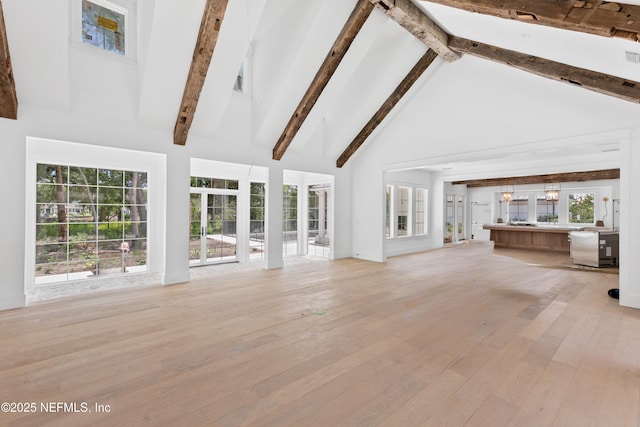 260 Autumn Tide Trl, Ponte Vedra, FL 32081 - unfurnished living room featuring high vaulted ceiling, hardwood / wood-style flooring, beam ceiling, and plenty of natural light