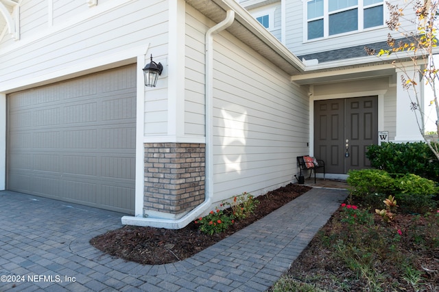 property entrance featuring a garage