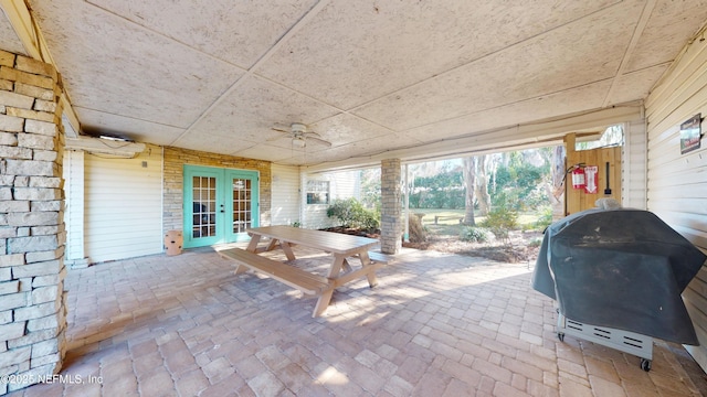 view of patio featuring french doors, ceiling fan, and a grill