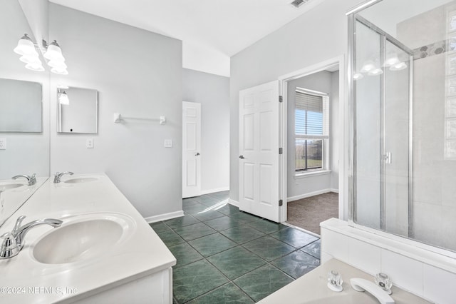 bathroom with vanity, tile patterned floors, a shower with door, and vaulted ceiling