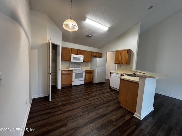 kitchen featuring kitchen peninsula, pendant lighting, white appliances, and dark wood-type flooring