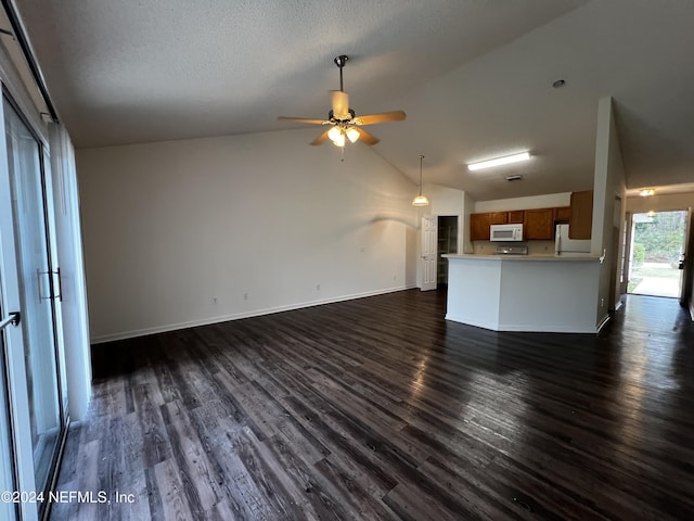 unfurnished living room featuring a textured ceiling, dark hardwood / wood-style flooring, ceiling fan, and lofted ceiling