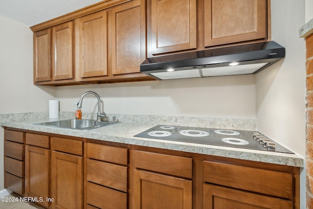 kitchen featuring sink and black electric cooktop