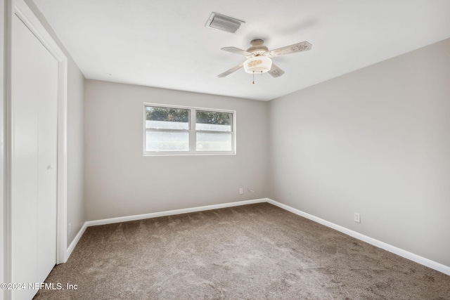 unfurnished bedroom with carpet flooring and ceiling fan