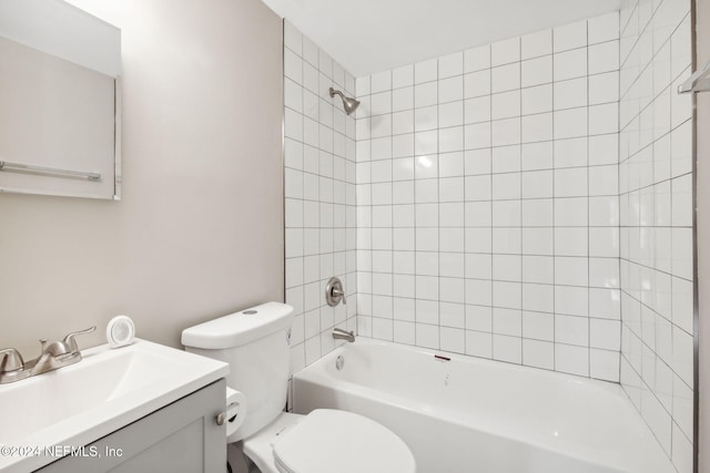 full bathroom featuring vanity, toilet, and tiled shower / bath