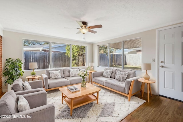 sunroom featuring ceiling fan