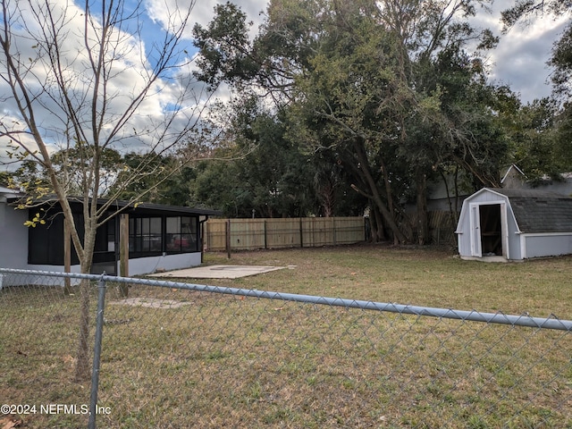 view of yard with a patio area and a shed