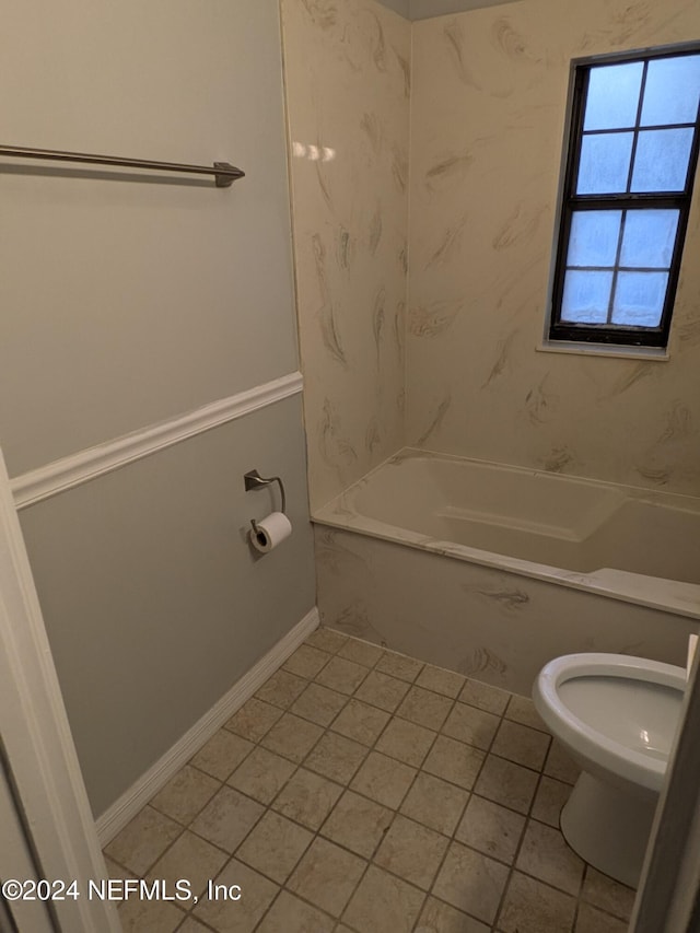 bathroom featuring shower / bathing tub combination, toilet, and tile patterned floors