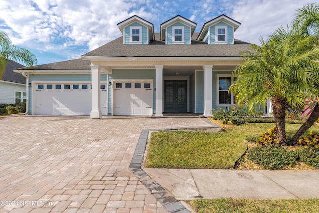 view of front of home featuring a garage and french doors