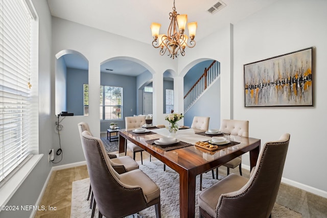 dining space with a chandelier