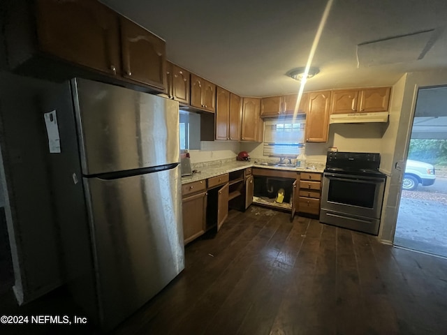 kitchen featuring stainless steel appliances, dark wood-type flooring, and sink