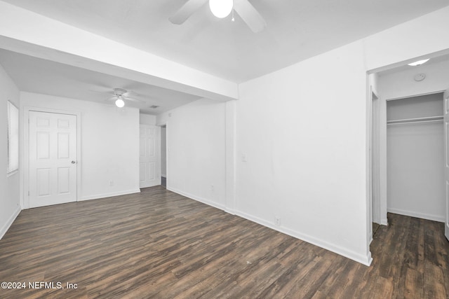 interior space with ceiling fan and dark wood-type flooring