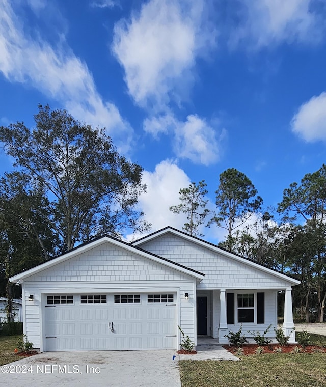 view of front of property with a garage