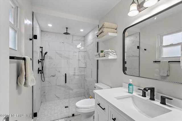 bathroom with vanity, toilet, and walk in shower