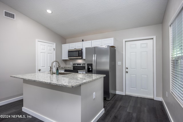 kitchen with a kitchen island with sink, sink, dark hardwood / wood-style floors, appliances with stainless steel finishes, and white cabinetry