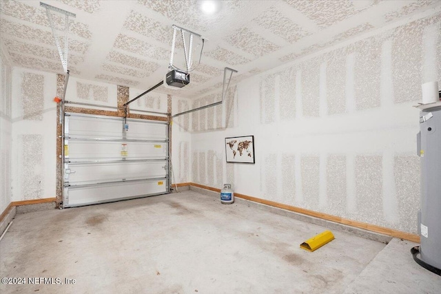 garage featuring a garage door opener and water heater