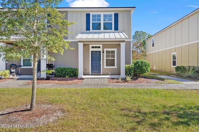 view of front of home with a front lawn