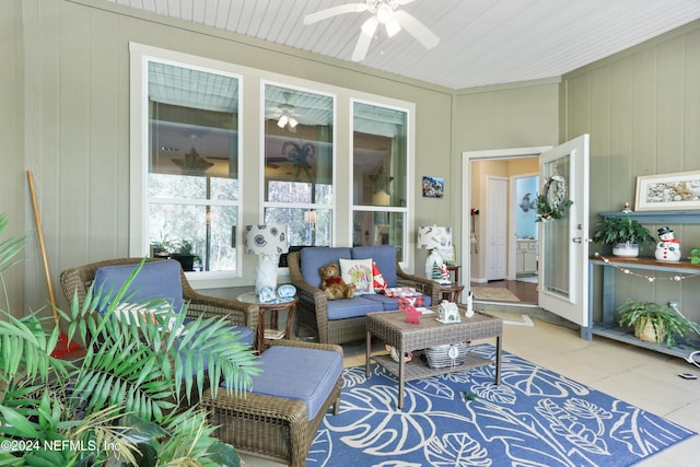 sunroom / solarium featuring ceiling fan