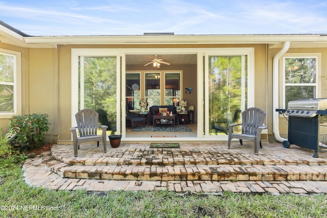 view of exterior entry featuring a patio