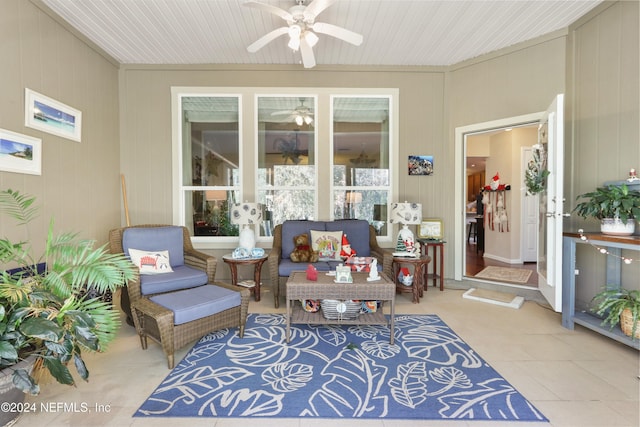 exterior space with ceiling fan and wooden walls