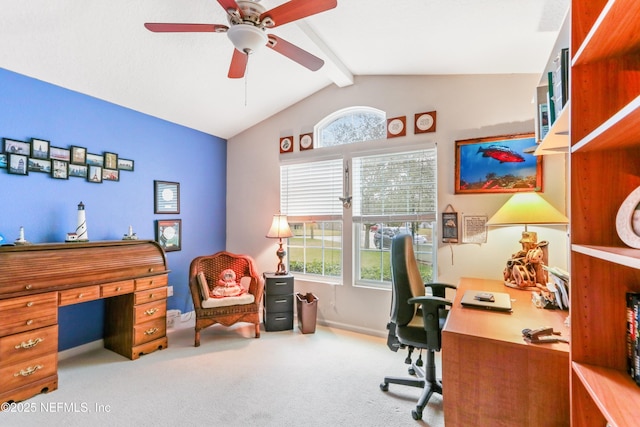 carpeted home office with ceiling fan and lofted ceiling with beams