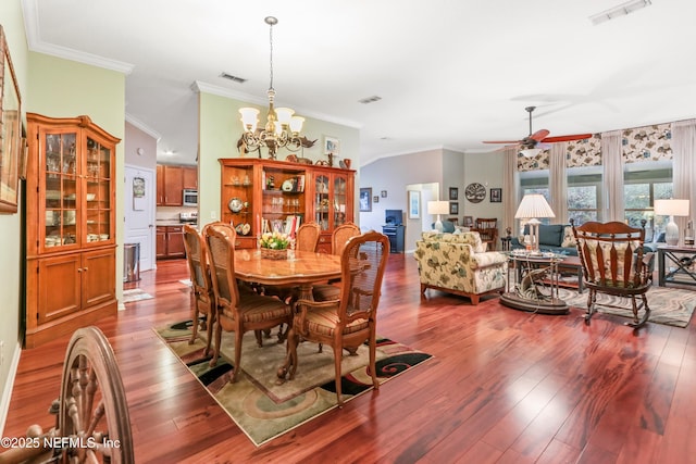 dining room featuring crown molding, ceiling fan with notable chandelier, and hardwood / wood-style flooring