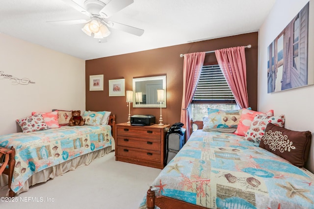 bedroom featuring ceiling fan and light carpet