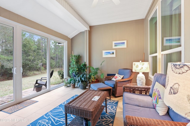 sunroom / solarium with lofted ceiling and ceiling fan