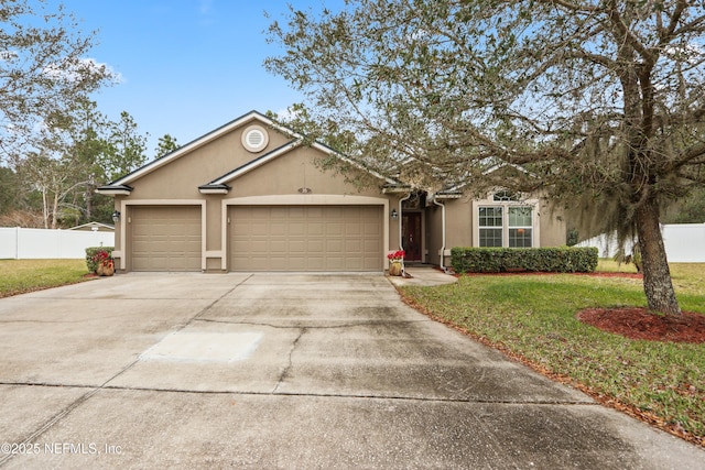 ranch-style home featuring a front yard and a garage