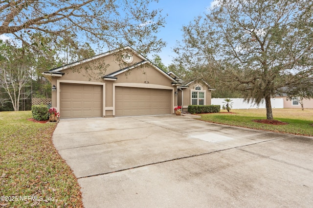 ranch-style home with a garage and a front yard