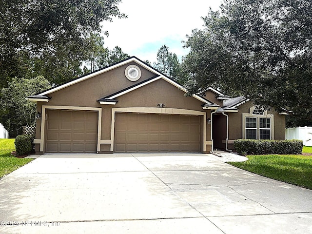 35 Sunlight Way, Saint Augustine, FL 32092 - single story home with stucco siding, a garage, and concrete driveway