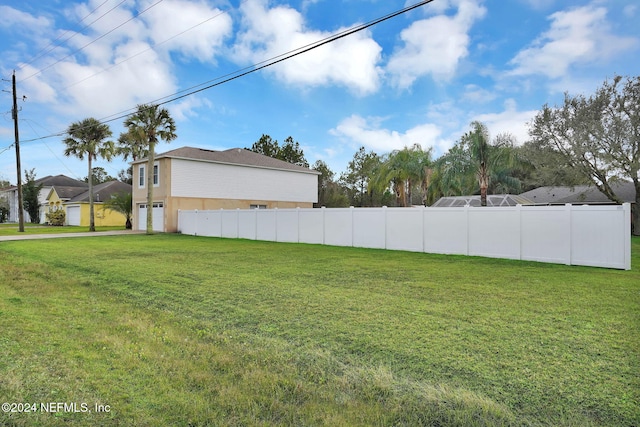 view of yard featuring a garage